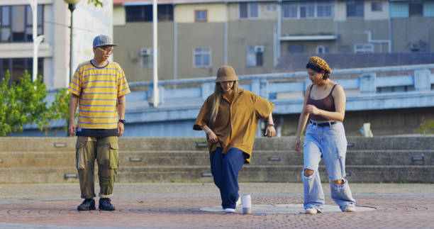 istock Group of young Taiwanese practicing dance in the park 1388511952