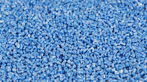 istock Secondary granule made of polypropylene, Blue Plastic pellets crumbles to the table. Plastic raw materials in granules for industry. Polymer resin. Raw plastic recycling concept 1388517968