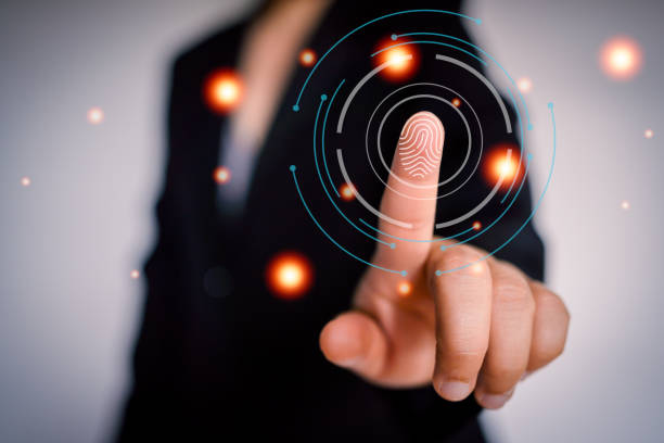 istock Businesswoman scanning her finger to unlock work system, anti-theft system, high-security storage for digital work 1388519364