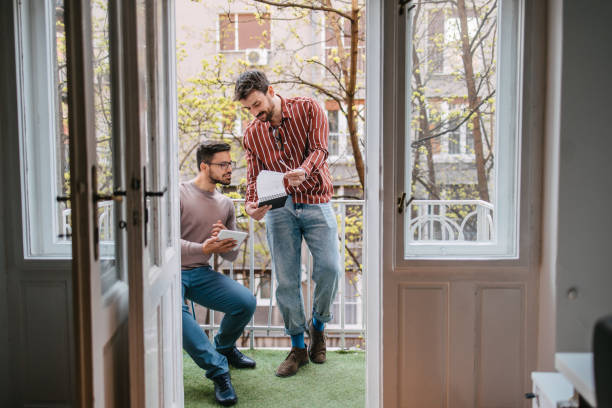 istock Coworkers looking at sketchbook 1388521478