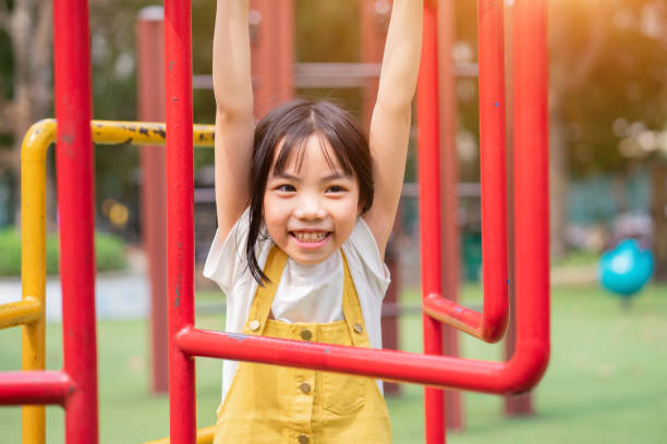 istock Asian child playing at park 1388524051