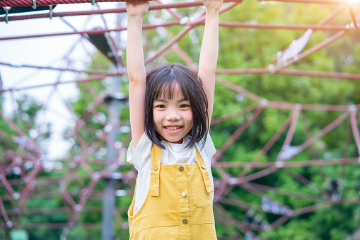 Asian child playing at park