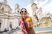 Woman with ice cream while traveling in Rome