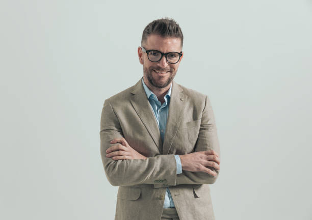 istock happy businessman with glasses folding arms 1388526478