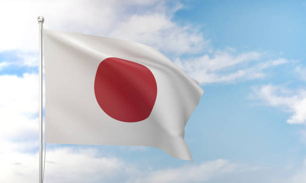 istock Japanese flag waving in the blue sky. 1388527748