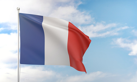 French flag waving in the blue sky. Politics and Government Concept.