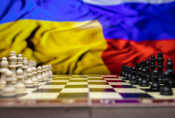 istock War between Russia and Ukraine, conceptual image of war using chess board, pieces and national flags on the background. Ukrainian & Russian crisis, political conflict. Stop the war 2022 1388527963