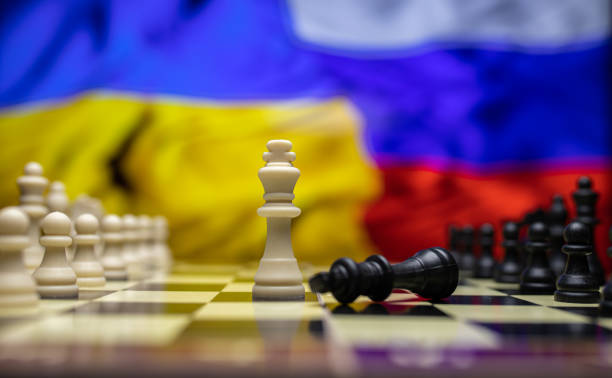 istock War between Russia and Ukraine, conceptual image of war using chess board, pieces and national flags on the background. Ukrainian & Russian crisis, political conflict. Stop the war 2022 1388527969