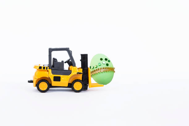 Easter egg on Yellow forklift truck isolate on white background, simple Easter card background