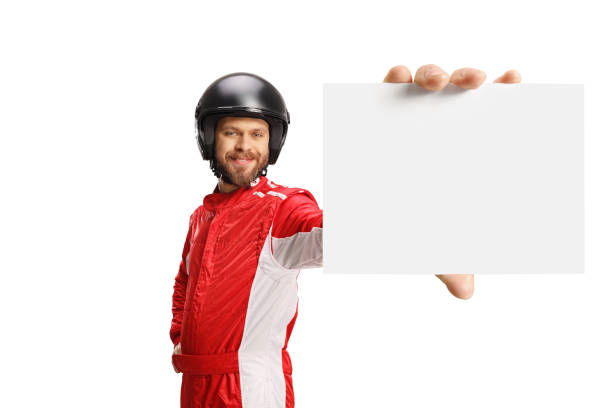 istock Racer holding a blank card in front of camera 1388530616