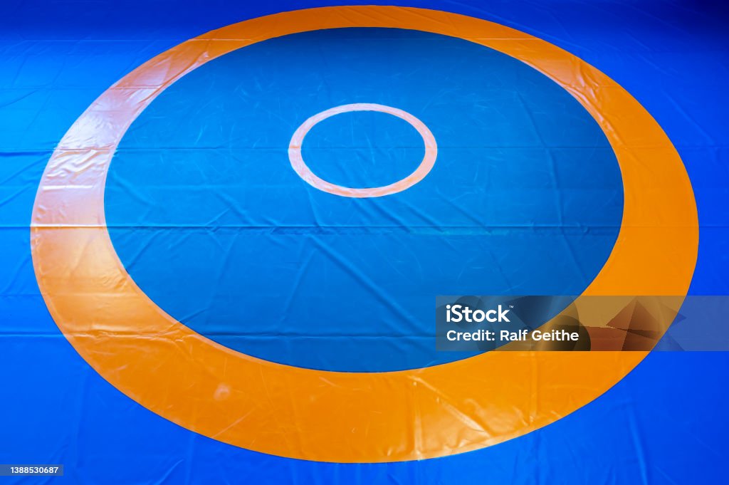 Blank wrestling mat template with text space for customization wrestling mat with marked fighting area in detail Wrestling Stock Photo