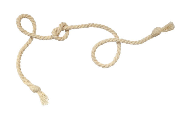 istock Beige cotton curled rope isolated on white background. 1388535392
