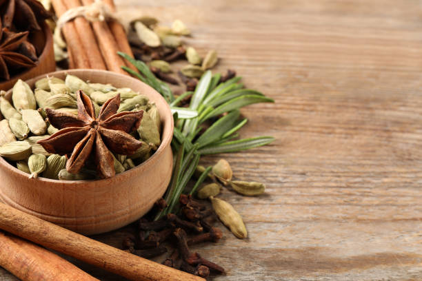 Composition with mulled wine ingredients on wooden table, closeup. Space for text Composition with mulled wine ingredients on wooden table, closeup. Space for text cardamom stock pictures, royalty-free photos & images