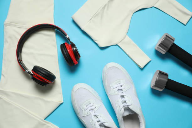istock Stylish sportswear and equipment on light blue background, flat lay 1388538436