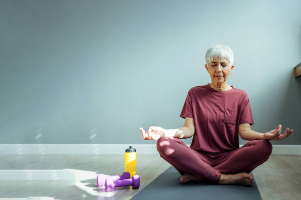 istock Fitness female practicing Padmasana at gym 1388539953