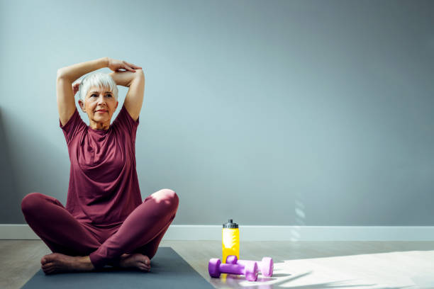 istock Smiling sporty woman stretching arms 1388542499