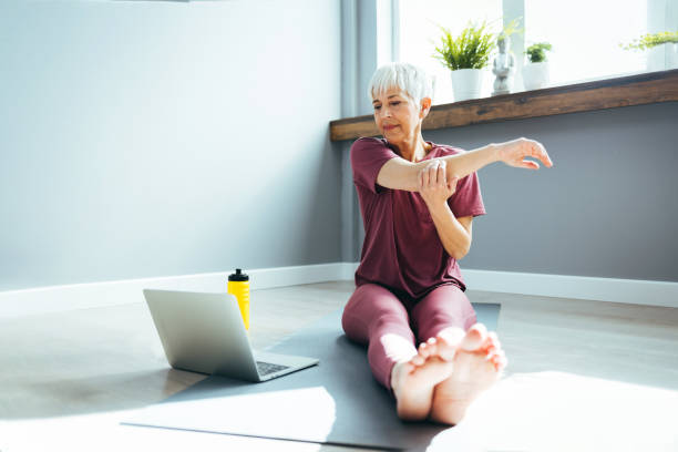 istock Mature Woman Exercising At Home. 1388542579