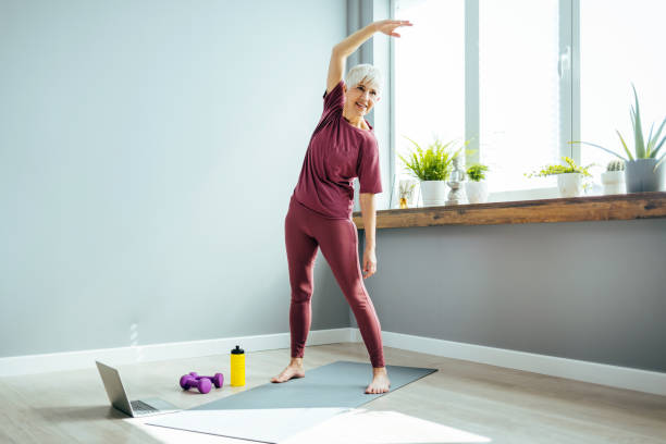 istock Woman performing stretching exercise 1388542631
