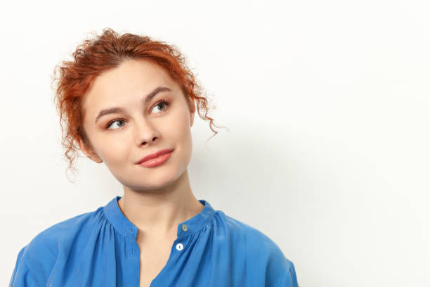 Studio portrait of an attractive 20 year old red haired woman stock photo