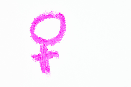 Pink stick-figure symbol representing the female, feminism and femininity.