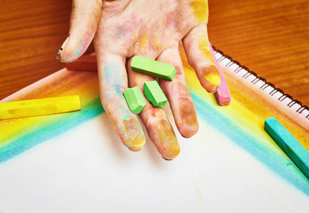 Young Womans Hand Holding Chunky Oil Pastel Crayons Over An Art Notebook  Stock Photo - Download Image Now - iStock