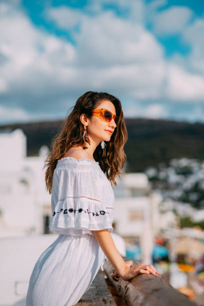 istock Beautiful Woman Watching Outside From the Terrace 1388549148