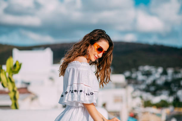 istock Beautiful Woman Watching Outside From the Terrace 1388549977