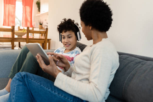 istock Boy and his mom using tablet and surfing the net 1388551160