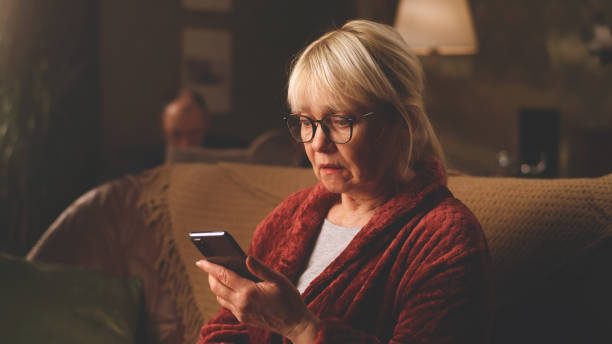 istock Scared aged woman reading shocking news 1388552684