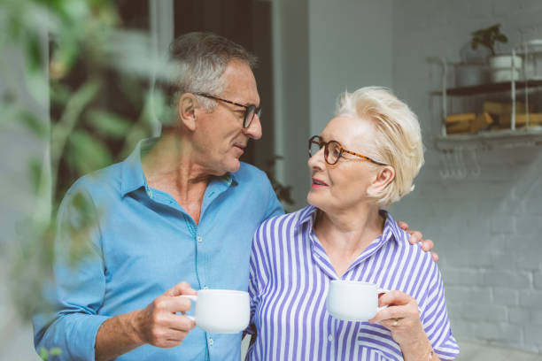 istock Elderly couple having coffee in apartment 1388559290