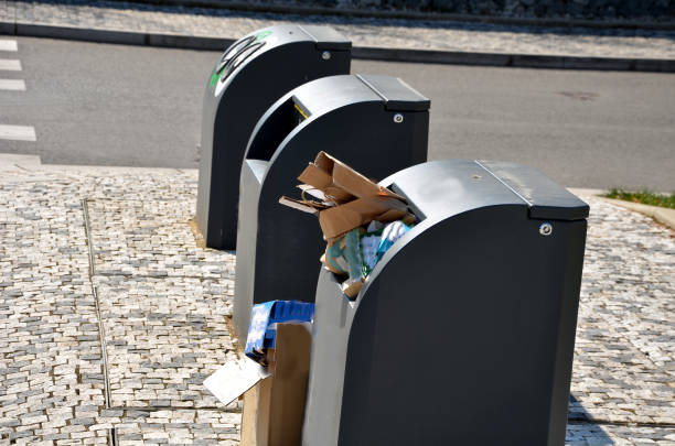istock underground waste sorting containers are created. they do not take up so much space in a square or square. the crane pulls out the whole container and dumps it. paving of gray concrete interlocking 1388559352