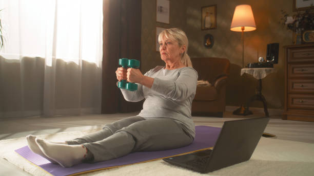 istock Grandma doing online workout at home 1388560037