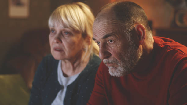 istock Elderly husband watching melodrama with wife 1388560356