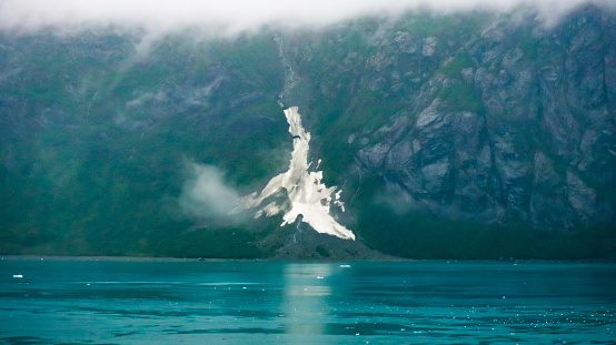 A large ice deposit on the side of a mountain in Glacier Bay National Park.