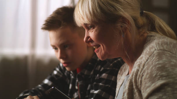istock Grandson copying files on laptop 1388562325