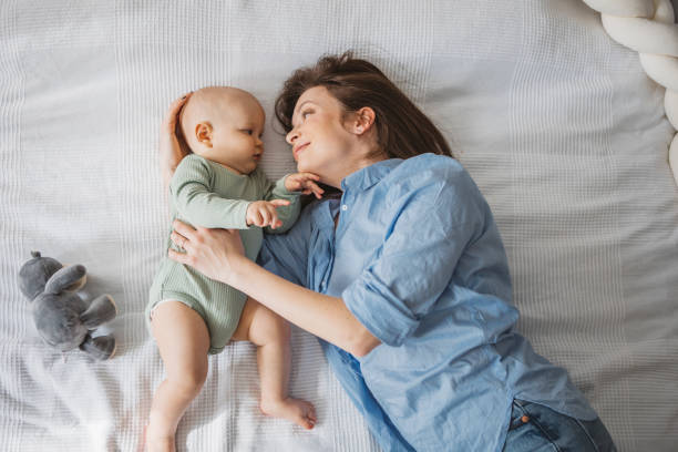 istock Mother and baby at home 1388564380