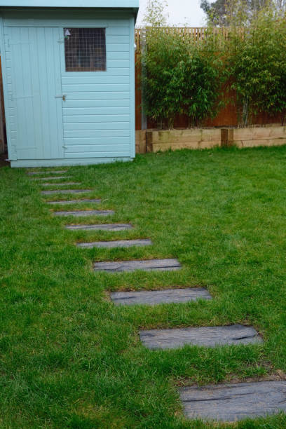 istock Garden path, Pentland type shed and raised railway sleeper flower beds 1388564514