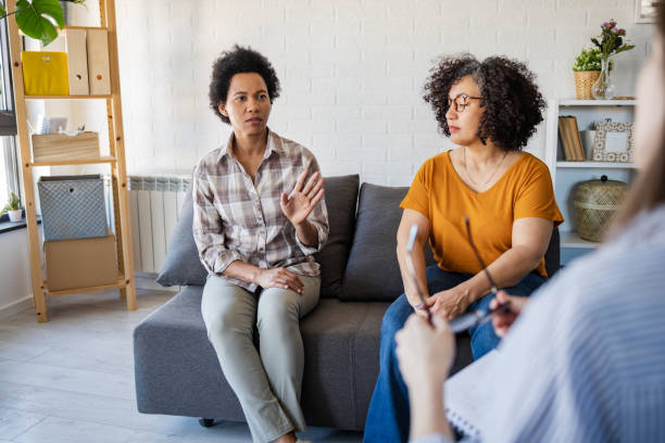 istock Homosexual couple talking with a therapist 1388564531