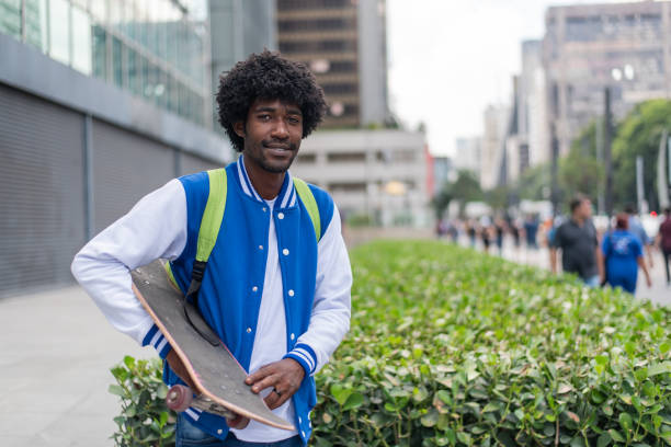 istock Portrait of student with skateboard 1388568144