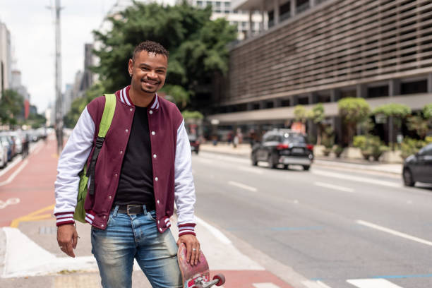 istock Portrait of student with skateboard 1388568214