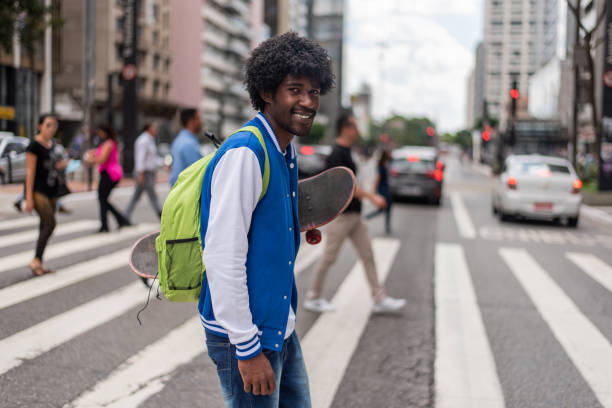 istock Student skateboarding in the city 1388568251