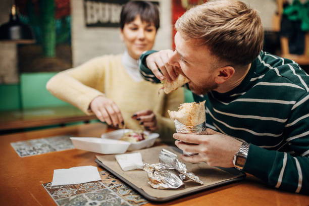 istock Couple in fast food restaurant 1388569347