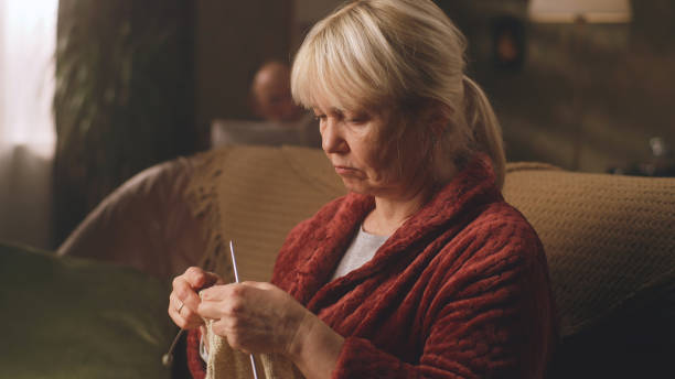 istock Grandmother knitting a warm sweater 1388569422