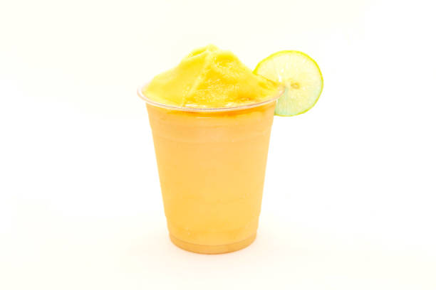 istock Peach slush with lemon slice served in a disposable cup. 1388569778