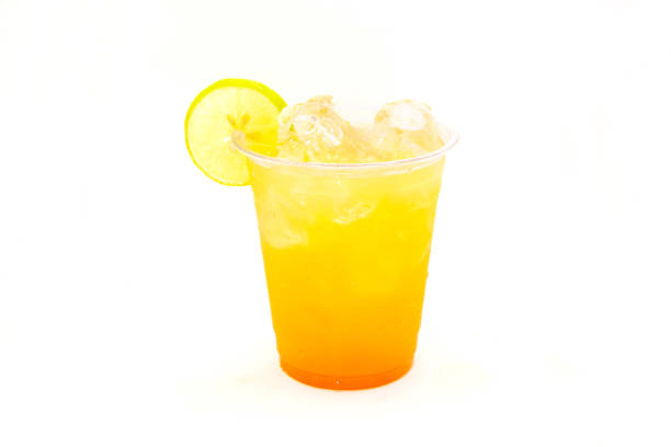 istock Peach mango drink filled with ice cubes and lemon slice. 1388569803