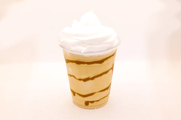 istock Flavoured milk shake with biscuit in a disposable plastic cup 1388569876