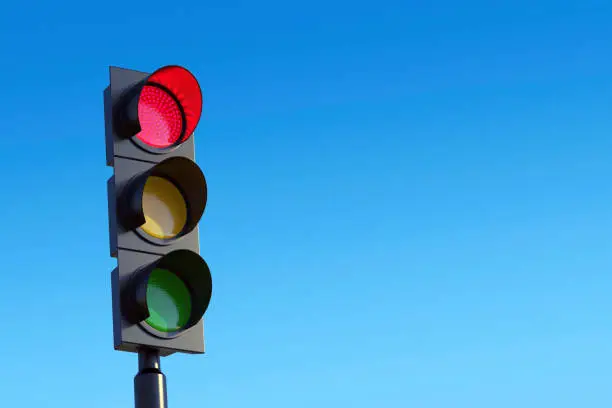 Photo of Red traffic light against sky