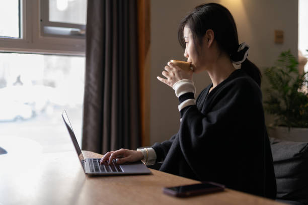 istock Asian women drinking coffee 1388575650