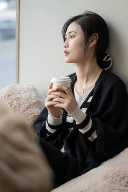 istock Asian women drinking coffee 1388575689