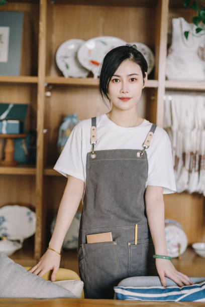 istock Young female barista 1388575800